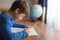 Little smart schoolboy solving mathematics examples homework