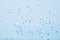 Little snowflakes confetti on blue background