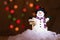 Little snowman figurine welcomes winter in the spotlight