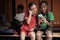 The little soccer teammates enjoying content on cell phone in a locker room