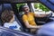 Little son looking at his father inside of vehicle