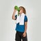 Little sportive boy child in sportswear drinking water from the bottle while standing with towel around his neck