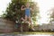 little sports girl jumps on a trampoline. Outdoor shot of girl jumping on trampoline, enjoys jumping in home. happy