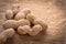 Little stack of peanuts on vintage wooden board