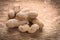 Little stack of peanuts on wooden board food and