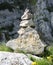 Little stack of stones called CAIRN in mountain used such as tra