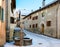 Little street with typical houses and fountain in the older part of Guarda, Inn District, Swiss canton of Graubunden, Switzerlan