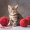 Little striped cat with red balls of knitting yarn. Life with cats, domestic pet, hobby, knitting concept Generative AI