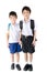 Little student sibling boy in uniform on white background