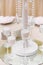 Little stylish glass candlesticks in which white bulk candles