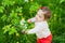 Little sweet girl at the garden