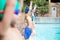 Little swimmers standing at poolside