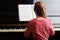 Little talented girl playing the piano