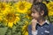 Little Thai girl in sunflower field.
