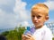 Little thirsty boy child drink water from bottle