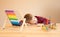 Little tired boy sits at the table and plays with wooden educational toys, put his head on the table and fell asleep.