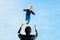 Little toddler boy, flying in the sky, dad throwing him high in the air. Family, enjoying winter view of snowy mountains and