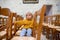 Little toddler boy, praying in chapel with candles in front