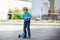 Little toddler boy riding on his bycicle in summer