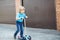 Little toddler boy riding on his bycicle in summer