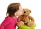 Little toddler girl kissing a teddy bear