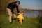 Little todler boy learns to walk, dad looks after him