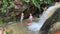 Little Triplet Sisters Swimming In Waterfall