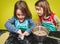 Little twin girls making home made pastry dumplings tortellini o