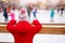 Little unrecognizable girl Christmas holiday background new year fair Modern female  looking ice rink chrismas holiday decorated