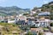 Little village build against a mountain slope at Madeira Island