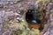 Little waterfall in sinkhole inside rock at mount Roraima