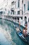 Little waterways in venice with empty gondola