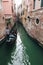 Little waterways in venice with gondolier