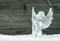 Little white angel in snow. Christmas decoration