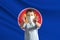 Little white boy in a protective mask on the background of the flag of Association of Southeast Asian Nations. Makes a