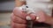 Little white hamster sitting in a girl\'s hand