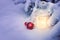 Little winter lanterns outdoors on a Christmas tree under snow,