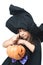 Little witch considers collected candy