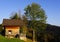 Little wooden house on the hill in autumn.