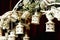 Little wooden lanterns hang from a wedding altar