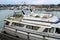 Littlehampton, Sussex, UK - October 25 2016: Old, dirty and abandoned luxury ocean motor cruiser moored on a riverbank in winter