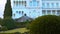 Livadia Palace. In the foreground of a landscape park plants