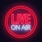 Live on air neon glowing sign on brick wall background