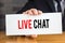 Live chat, message on white card and hold by