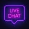 Live chat neon sign on dark background.