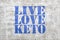 Live, love keto -  graffiti on stucco wall