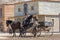 Live performance view of cowboy scenes, with 3 cowboys in wagon, on Oasys - Mini Hollywood, Spanish Western theme park, Western