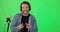 Live streaming, gaming and face of man on green screen for social media, technology and influencer. Mockup, podcast and