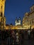 A lively crowd immersed in the enchanting ambiance of Prague\'s Old Town at night