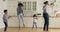 Lively happy african family dancing in the kitchen